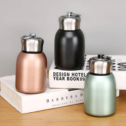 AM7802 COMPACT STAINLESS STEEL MINI BOTTLE WITH CARRYING RING FOR CONVENIENT ON THE GO HYDRATION